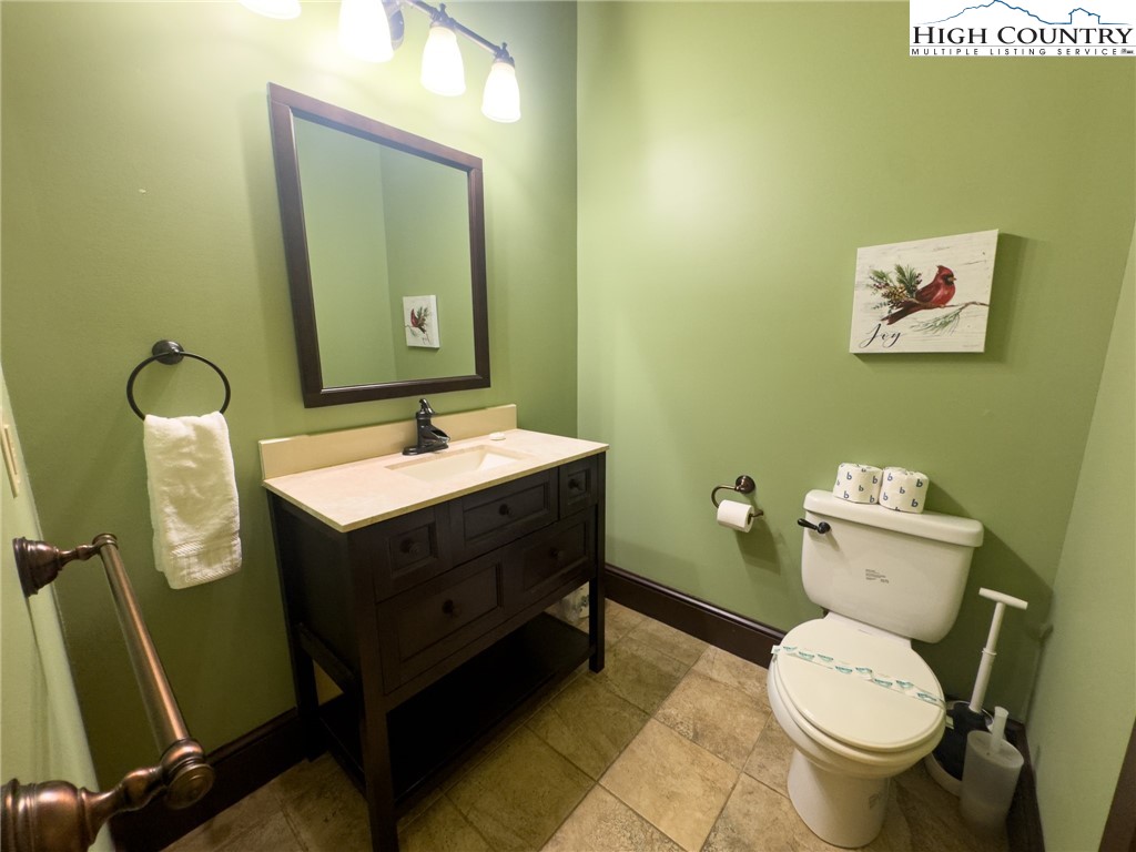 150 Tuscany Ridge Sugar Grove, NC 28679 - Photo 21 of 45 a bathroom with a toilet sink and mirror