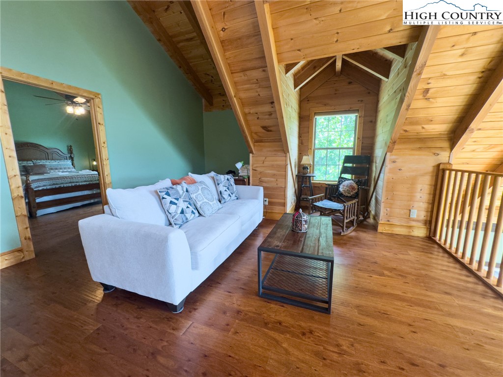 150 Tuscany Ridge Sugar Grove, NC 28679 - Photo 23 of 45 a living room with furniture and a floor to ceiling window