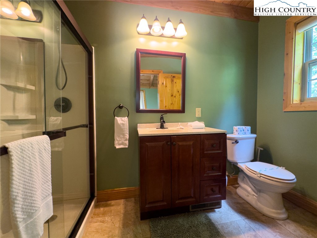 150 Tuscany Ridge Sugar Grove, NC 28679 - Photo 26 of 45 a bathroom with a sink vanity mirror and toilet