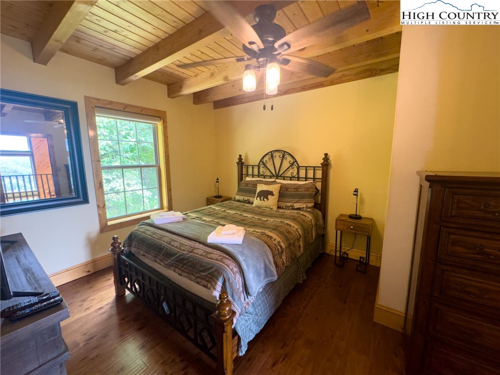150 Tuscany Ridge Sugar Grove, NC 28679 - Photo 27 of 45 a bedroom with a bed and wooden floor