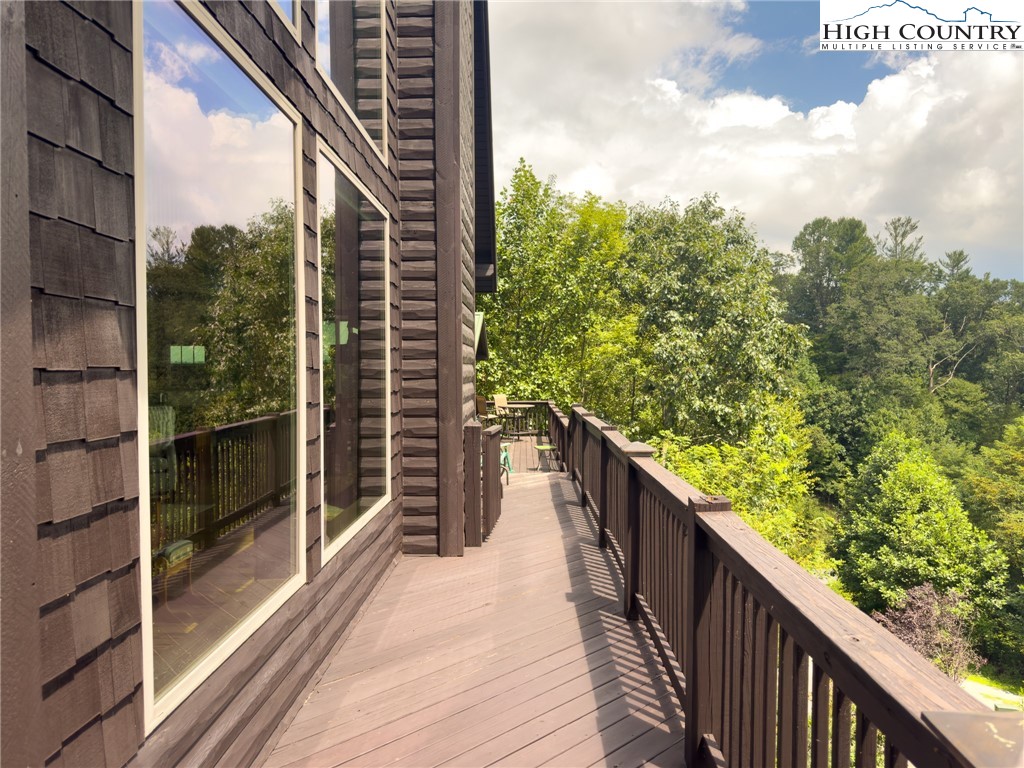 150 Tuscany Ridge Sugar Grove, NC 28679 - Photo 37 of 45 a balcony with wooden floor and fence in the balcony