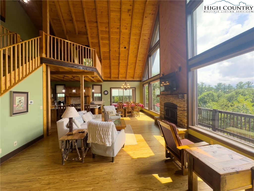 150 Tuscany Ridge Sugar Grove, NC 28679 - Photo 7 of 45 a view of a patio with table and chairs floor to ceiling window with yard