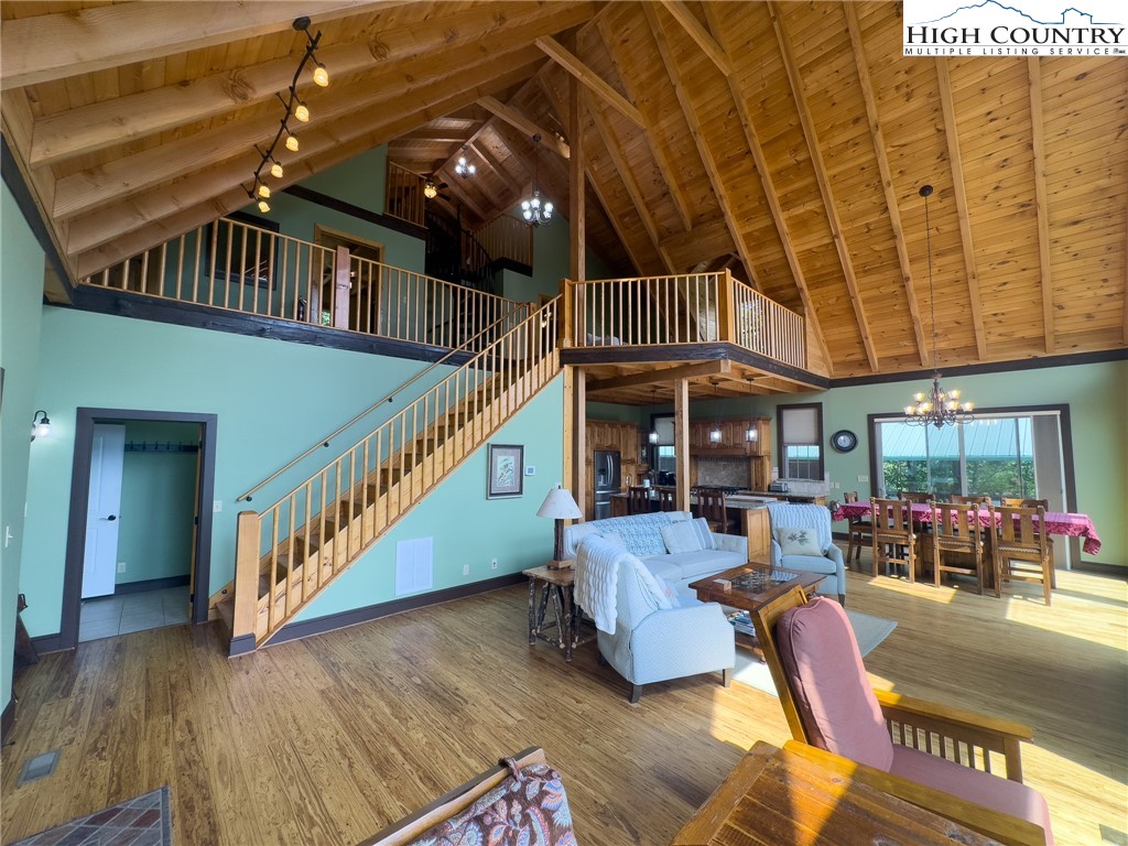 150 Tuscany Ridge Sugar Grove, NC 28679 - Photo 8 of 45 a bedroom with furniture staircase and a rug