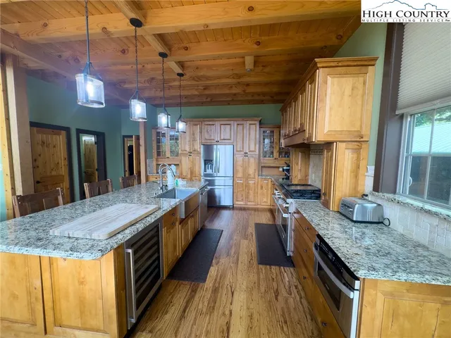 a kitchen with granite countertop counter space a sink and appliances