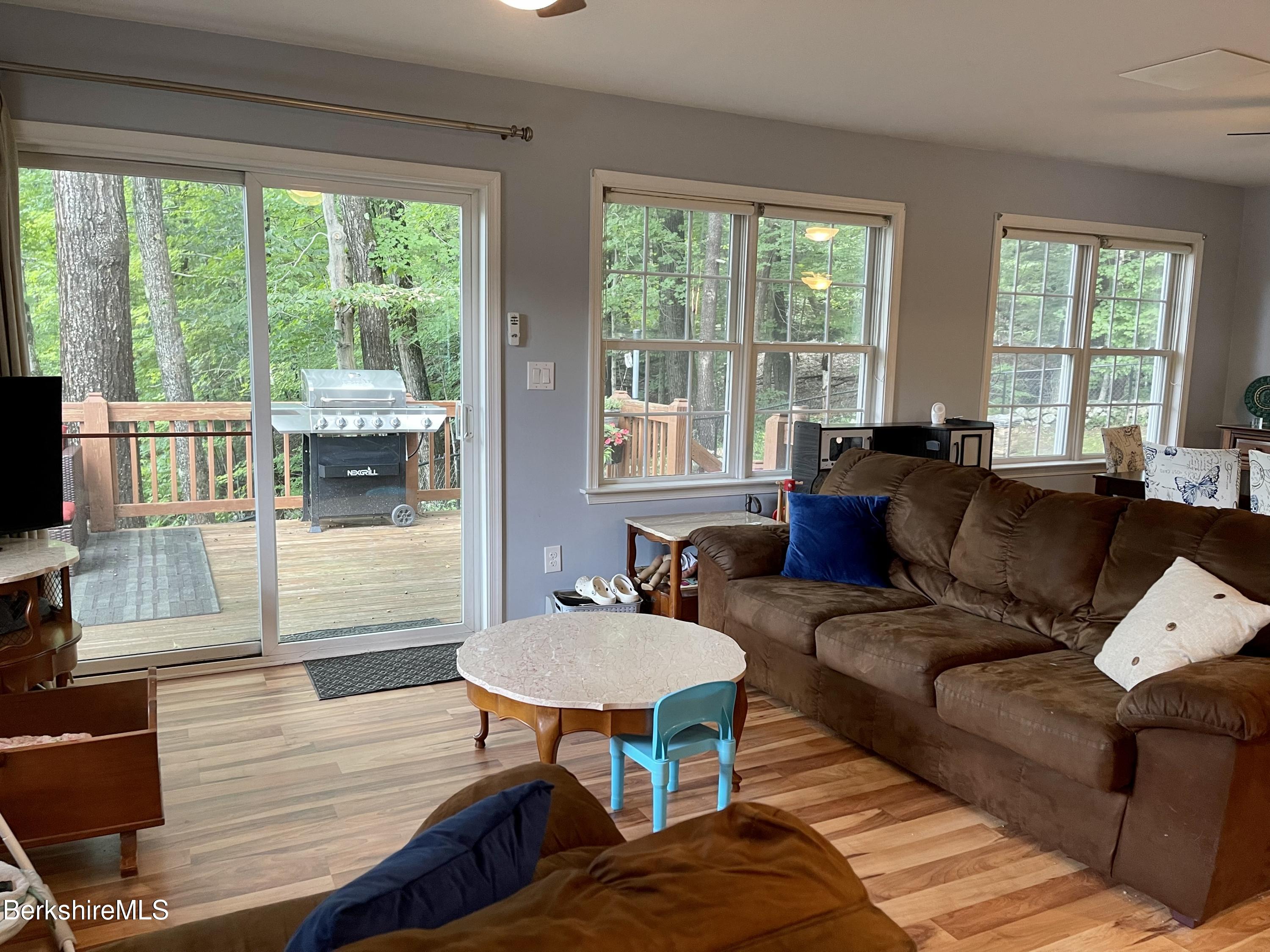 3512 Jacobs Ladder Road Becket, MA 01223 - Photo 11 of 42 a living room with furniture and a flat screen tv