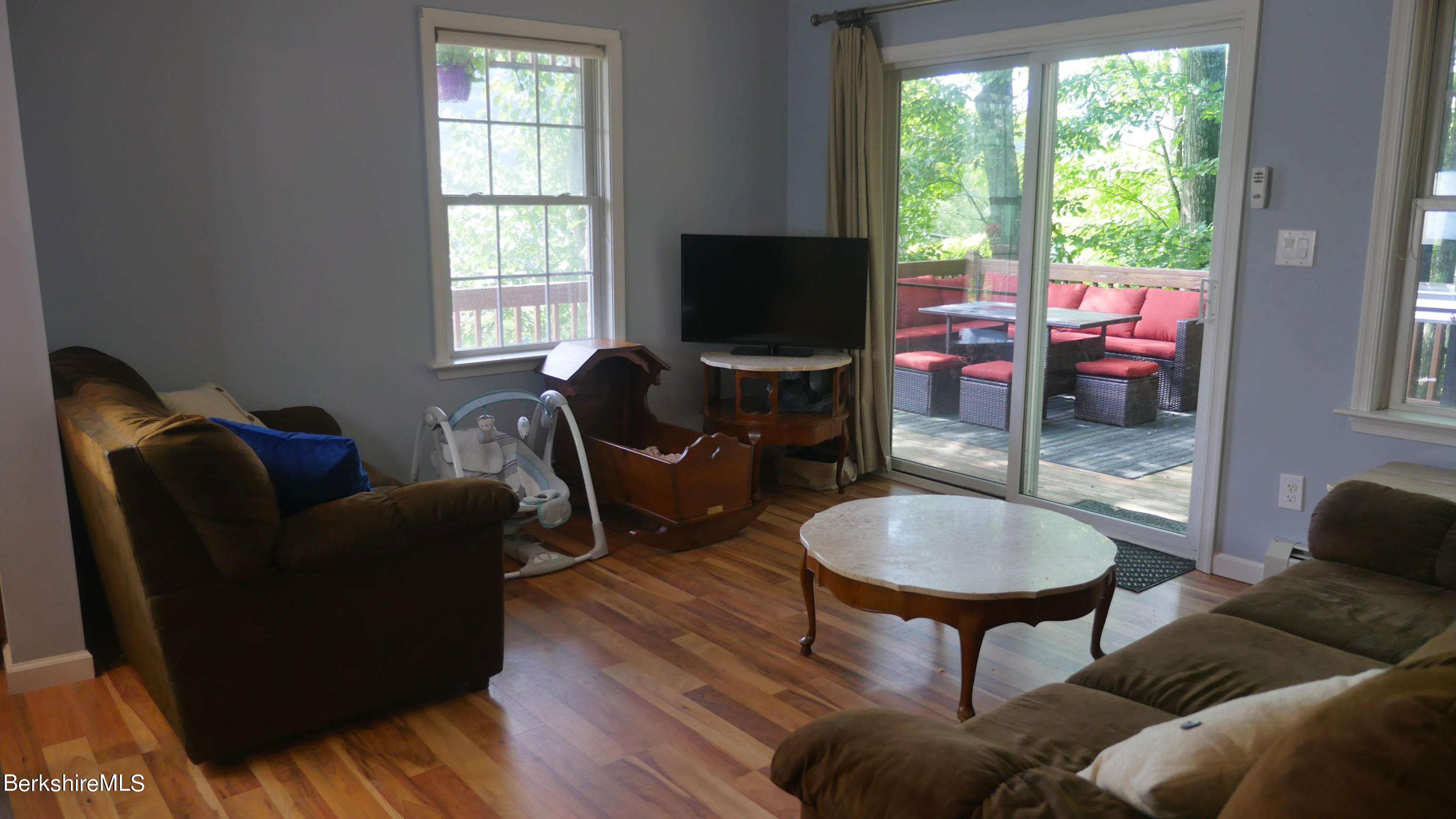 3512 Jacobs Ladder Road Becket, MA 01223 - Photo 12 of 42 a living room with furniture a flat screen tv and a large window