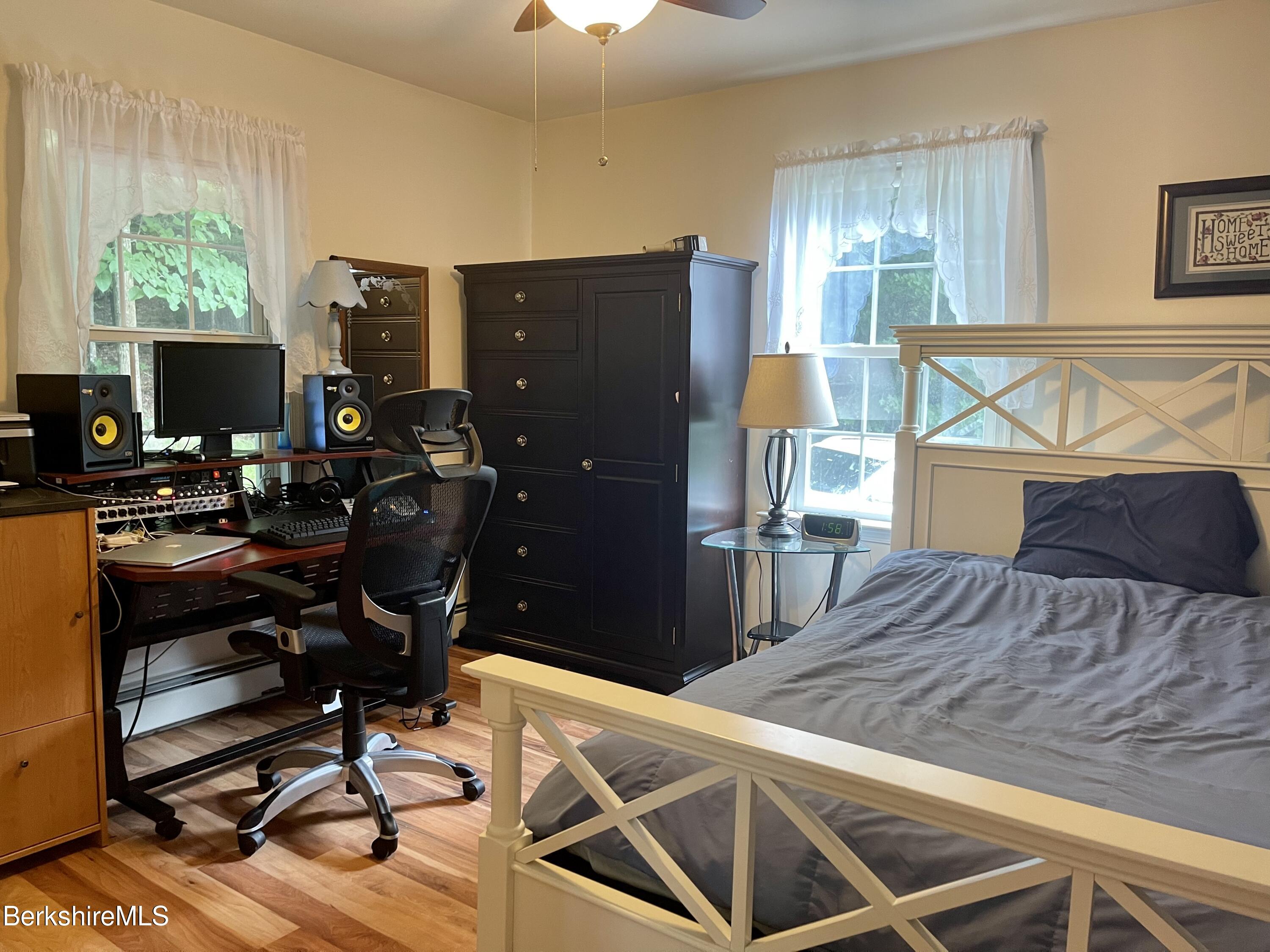 3512 Jacobs Ladder Road Becket, MA 01223 - Photo 15 of 42 a room with chairs and a computer on a desk next to a window