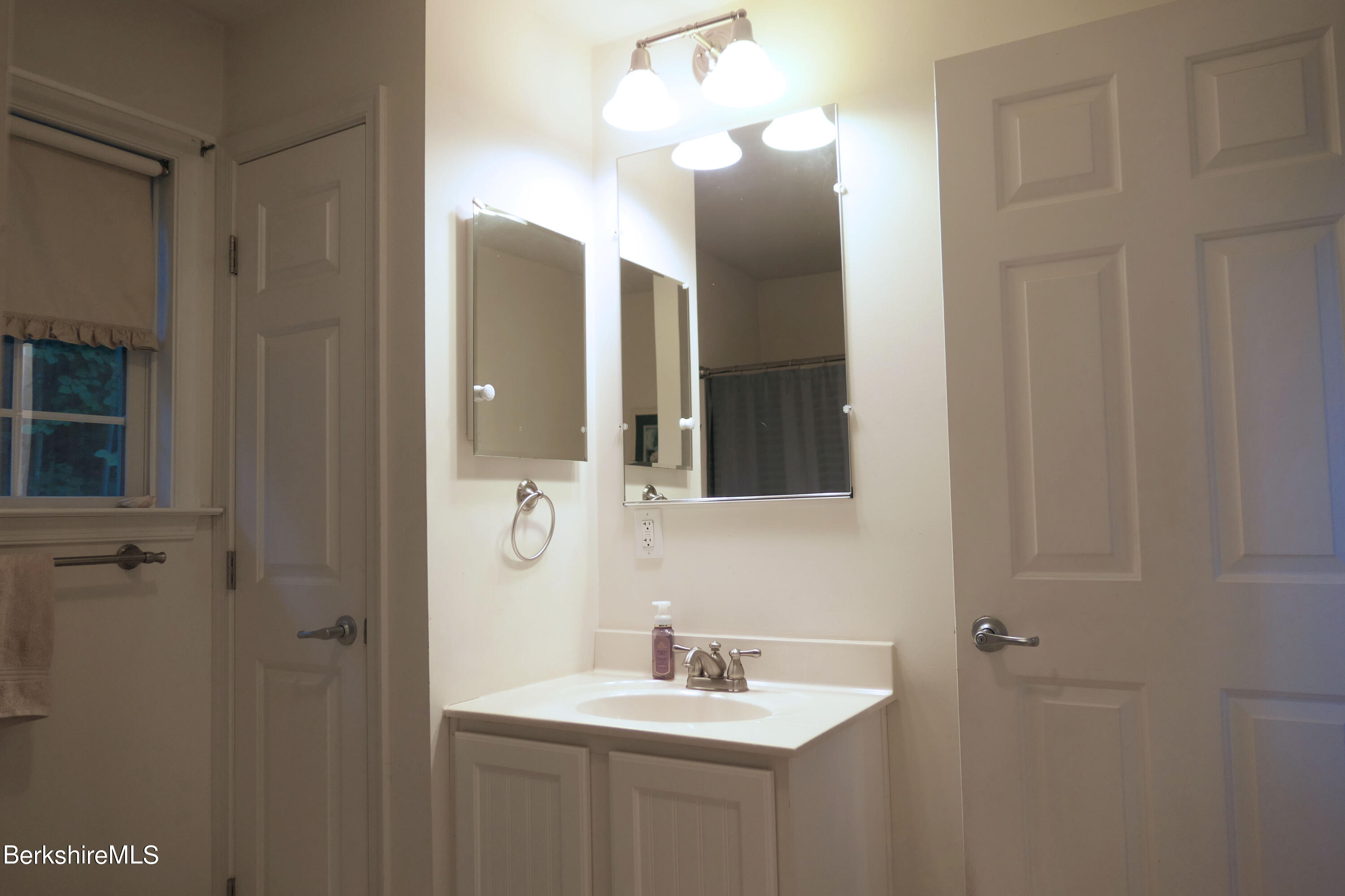 3512 Jacobs Ladder Road Becket, MA 01223 - Photo 17 of 42 a bathroom with a sink vanity and mirror