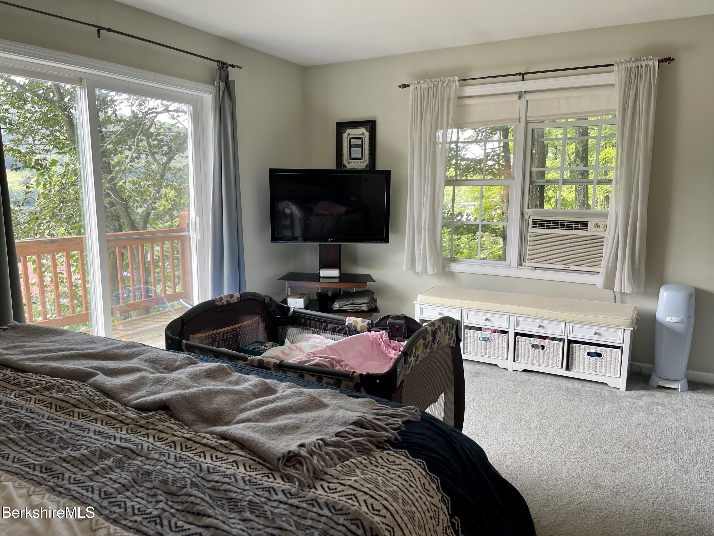 3512 Jacobs Ladder Road Becket, MA 01223 - Photo 20 of 42 a bed room with a bed television and a window