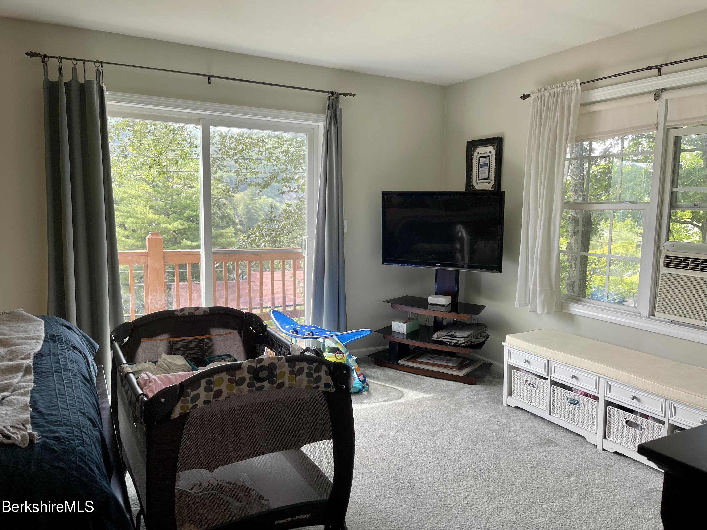 3512 Jacobs Ladder Road Becket, MA 01223 - Photo 21 of 42 a living room with furniture and a flat screen tv