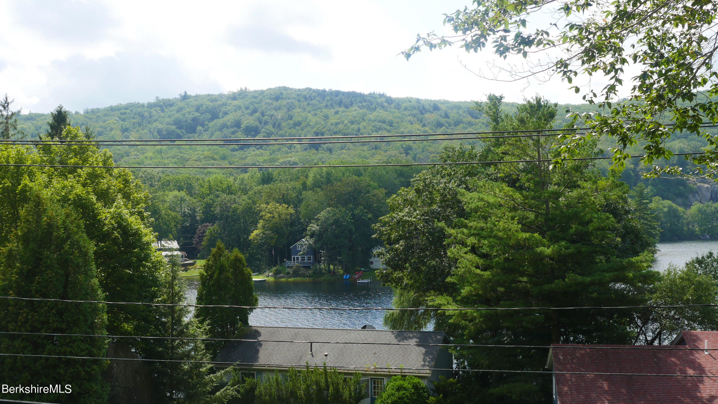 3512 Jacobs Ladder Road Becket, MA 01223 - Photo 22 of 42 a view of a green field with mountains in the background