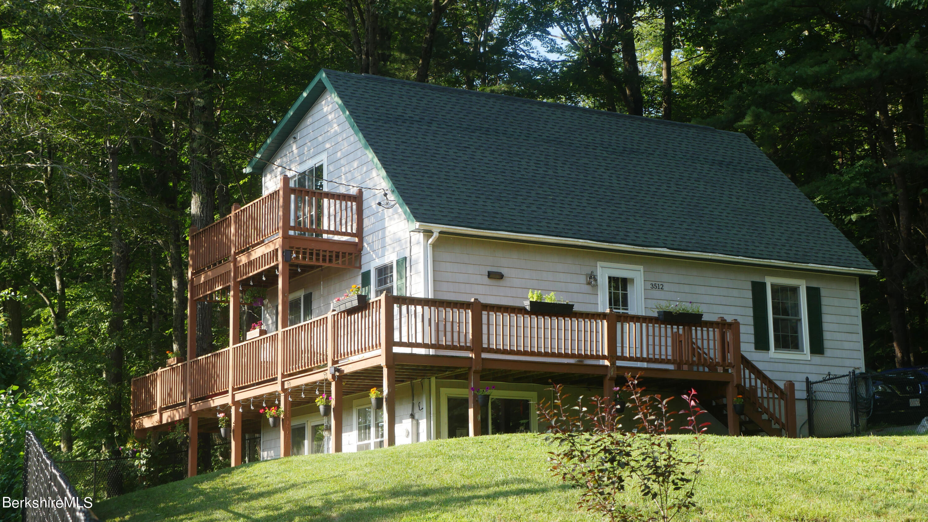 3512 Jacobs Ladder Road Becket, MA 01223 - Photo 4 of 42 a view of house with yard in front of it