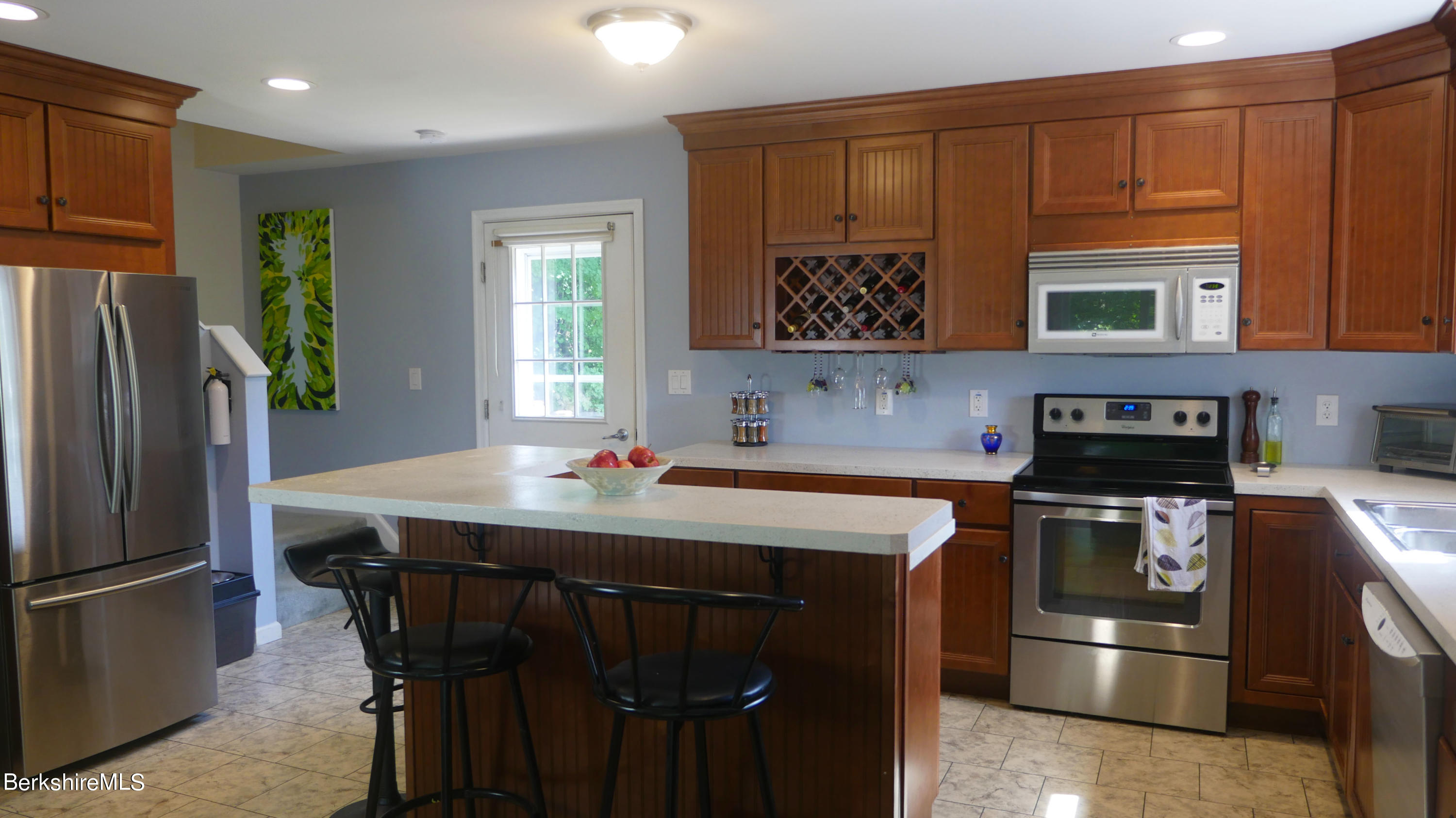 3512 Jacobs Ladder Road Becket, MA 01223 - Photo 5 of 42 a kitchen with stainless steel appliances granite countertop a stove a refrigerator and a microwave