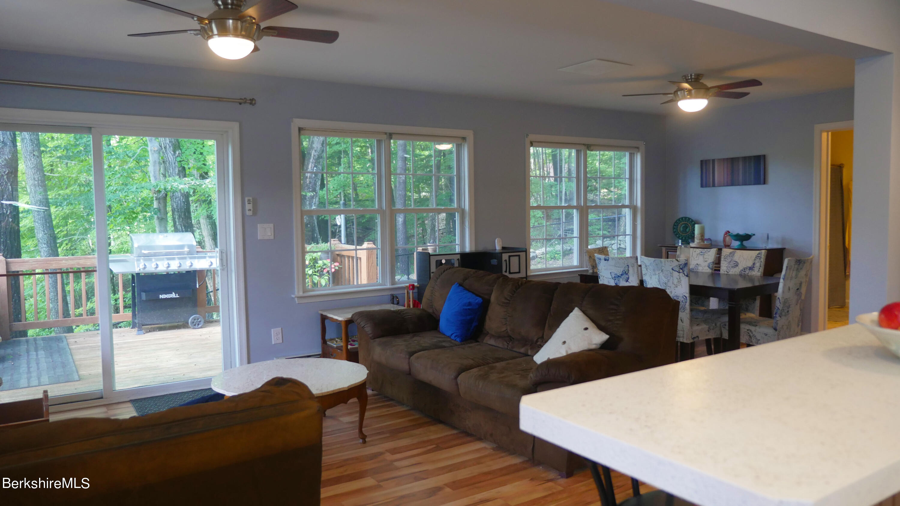 3512 Jacobs Ladder Road Becket, MA 01223 - Photo 10 of 42 a living room with furniture wooden floor and a large window