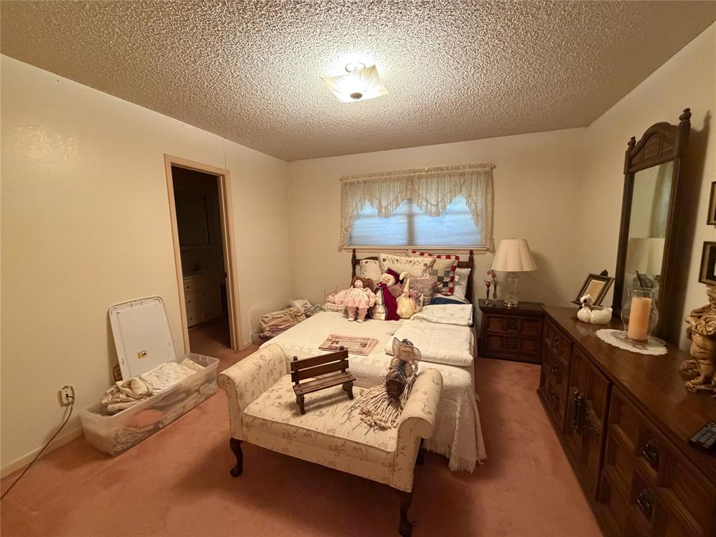 1218 Nottingham Road Abilene, TX 79602 - Photo 15 of 22 a bed room with furniture and a flat screen tv