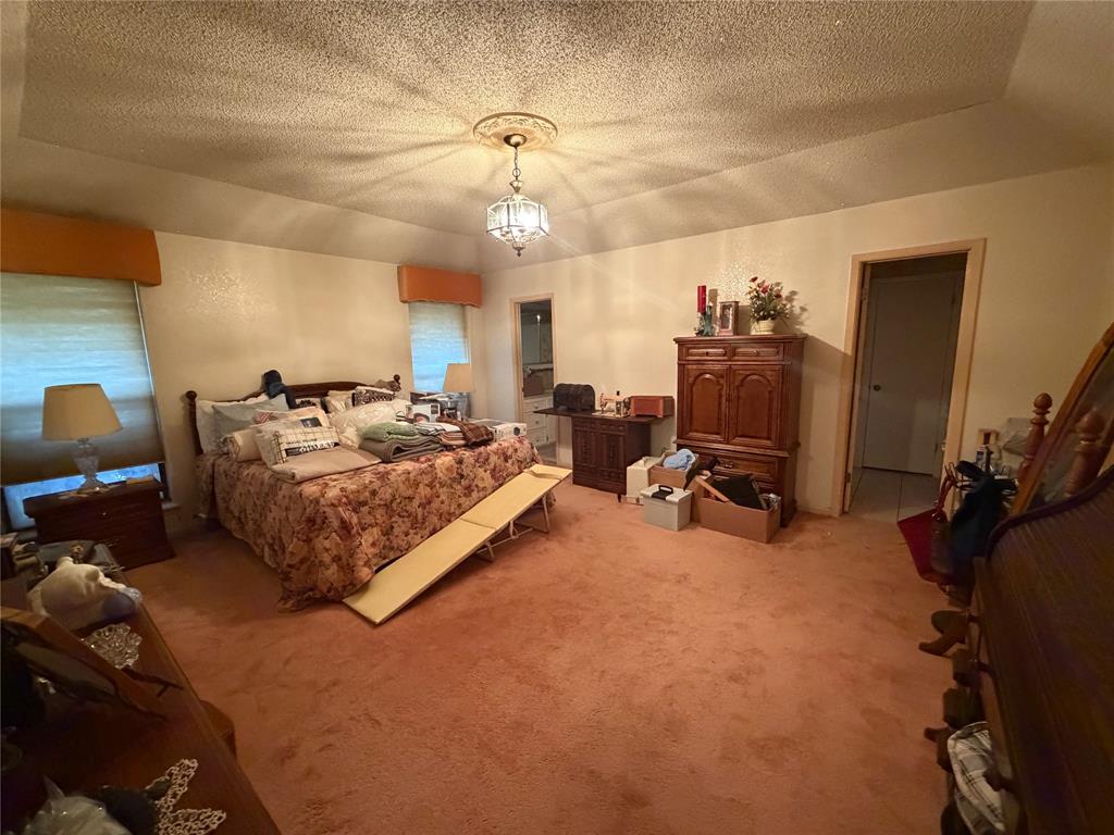 1218 Nottingham Road Abilene, TX 79602 - Photo 16 of 22 a bedroom with furniture a bed and gym equipment