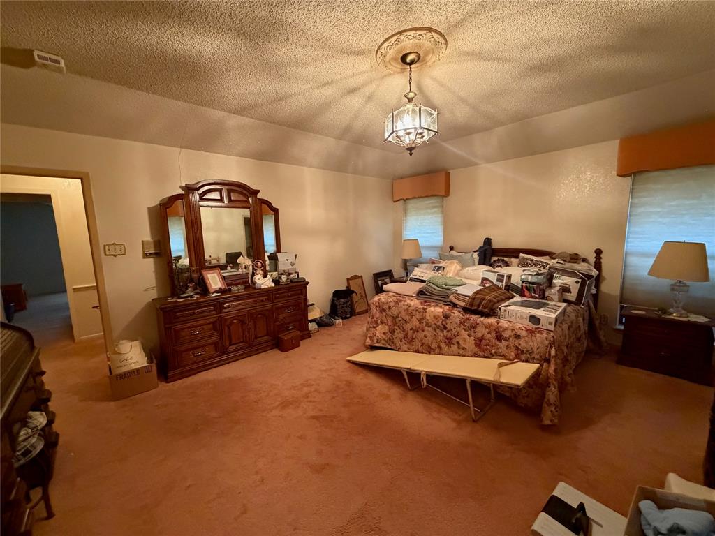 1218 Nottingham Road Abilene, TX 79602 - Photo 17 of 22 a bed room with furniture and a flat screen tv