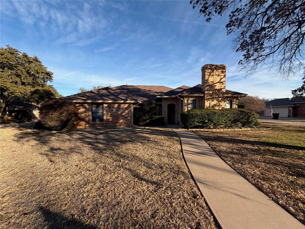 1218 Nottingham Road Abilene, TX 79602 - Photo 2 of 22 a front view of a house with a yard