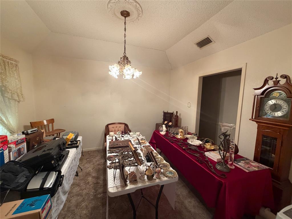 1218 Nottingham Road Abilene, TX 79602 - Photo 5 of 22 a room with furniture and a chandelier