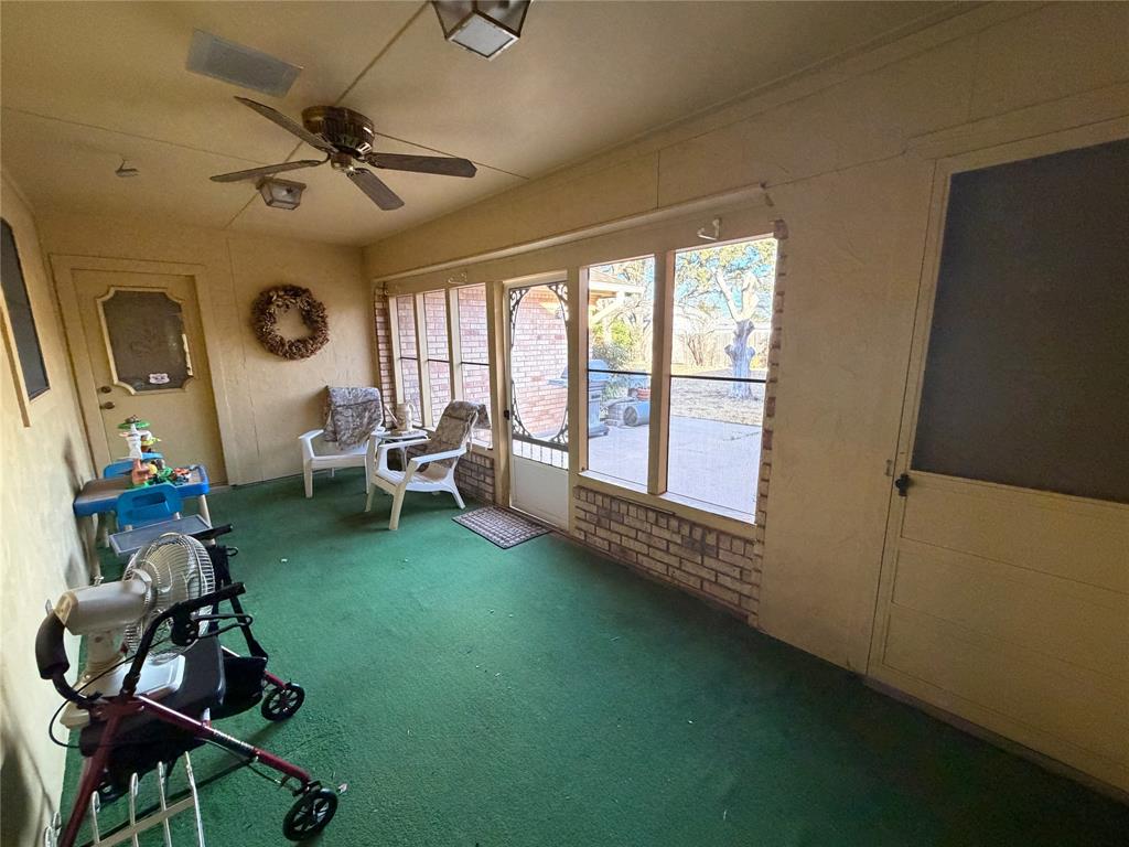 1218 Nottingham Road Abilene, TX 79602 - Photo 9 of 22 a living room with furniture and a floor to ceiling window