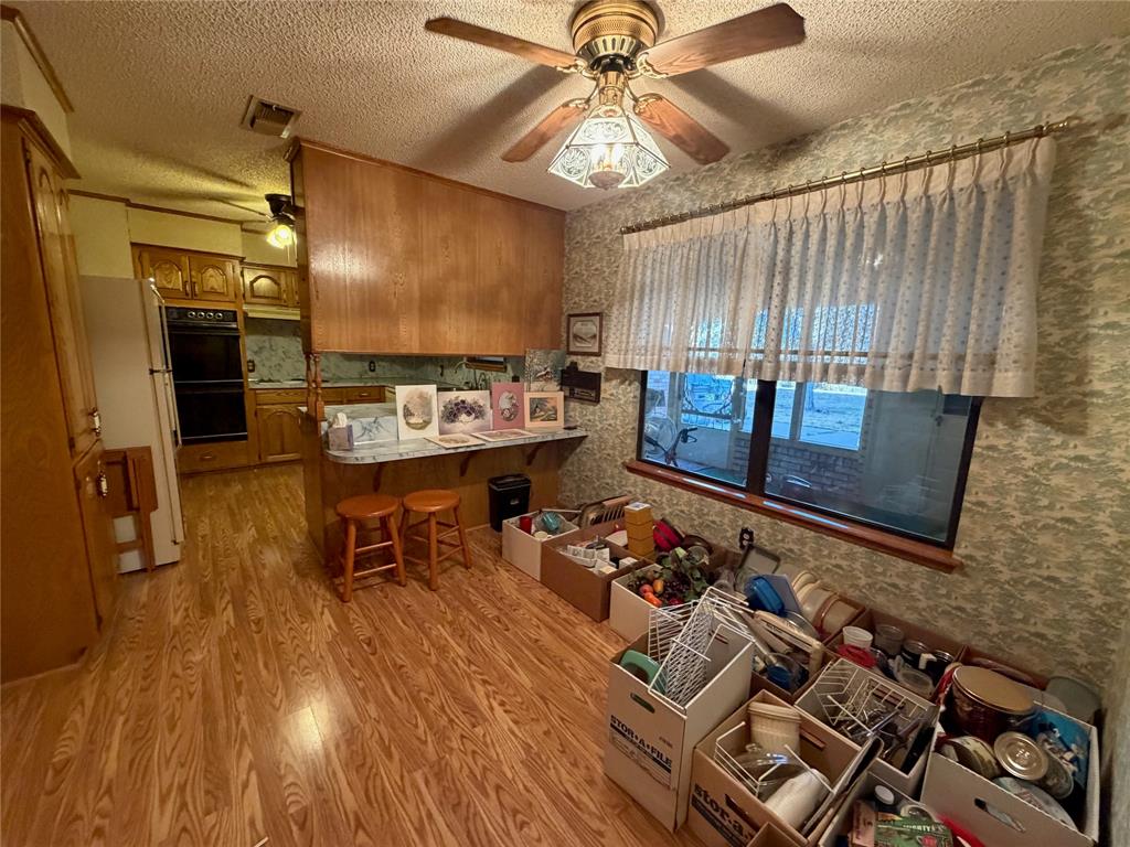1218 Nottingham Road Abilene, TX 79602 - Photo 10 of 22 a living room with furniture and wooden floor