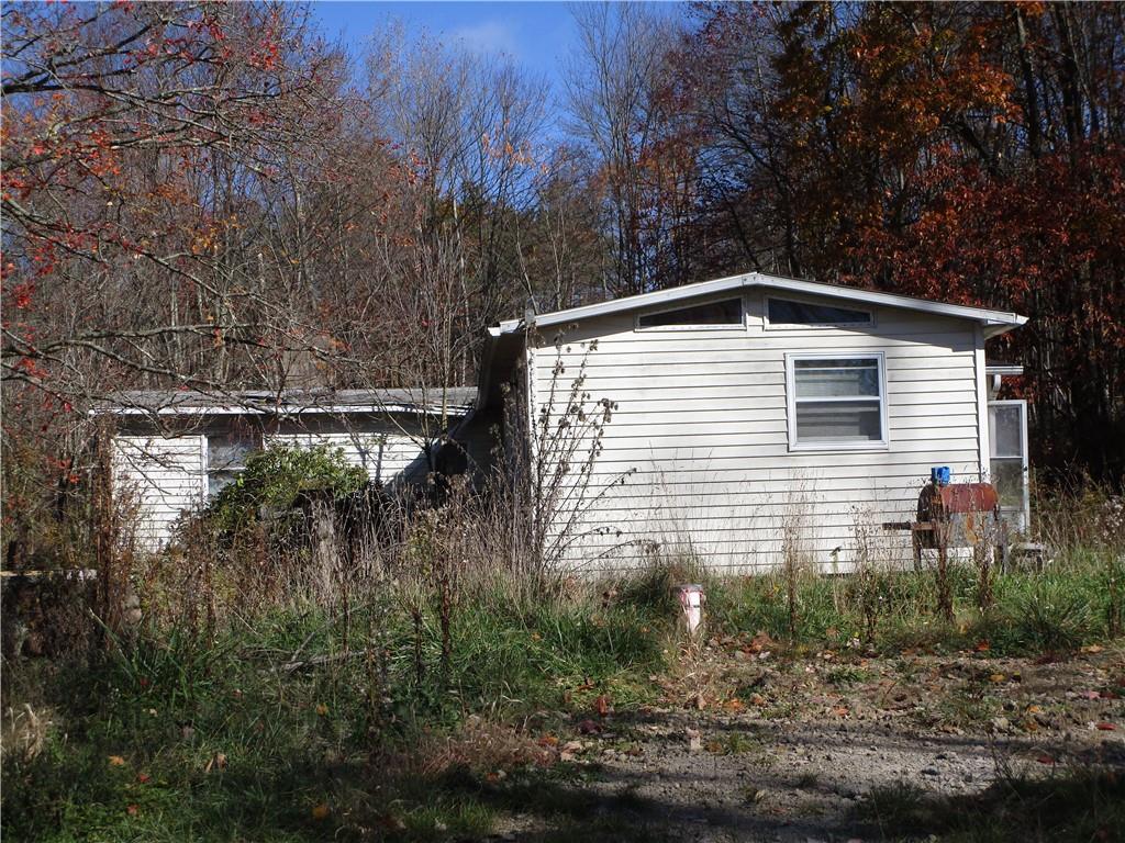151 Cottonwood Road Chicora, PA 16025 - Photo 4 of 6 a front view of a house with a yard