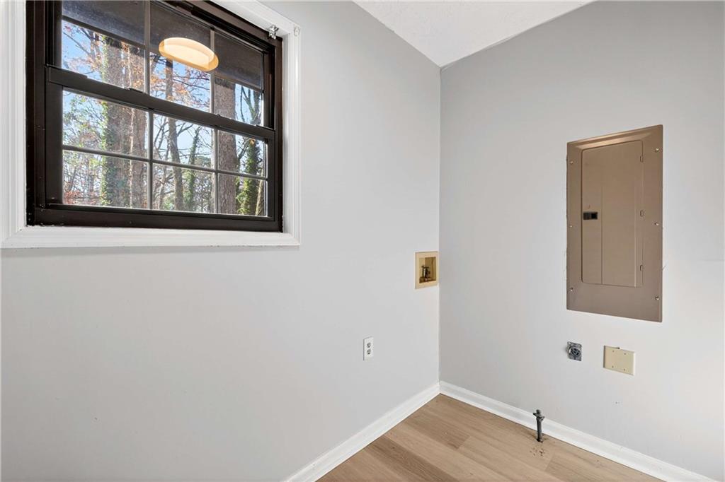 752 Maple Drive Riverdale, GA 30274 - Photo 15 of 35 a view of an empty room with wooden floor and a window