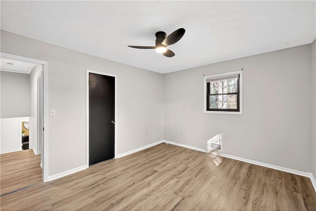 752 Maple Drive Riverdale, GA 30274 - Photo 19 of 35 a view of empty room with wooden floor
