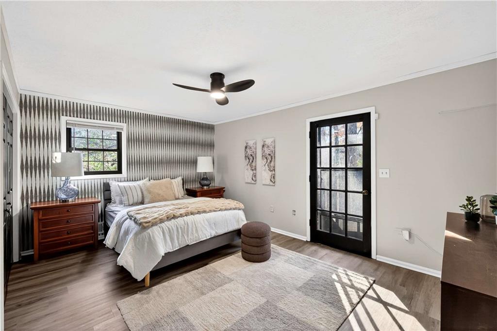 752 Maple Drive Riverdale, GA 30274 - Photo 20 of 35 a bedroom with a large bed and a window