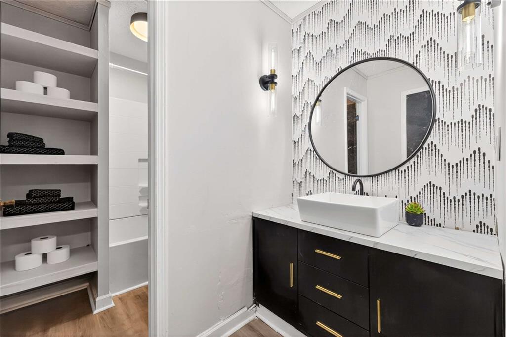752 Maple Drive Riverdale, GA 30274 - Photo 23 of 35 a bathroom with a sink and a mirror