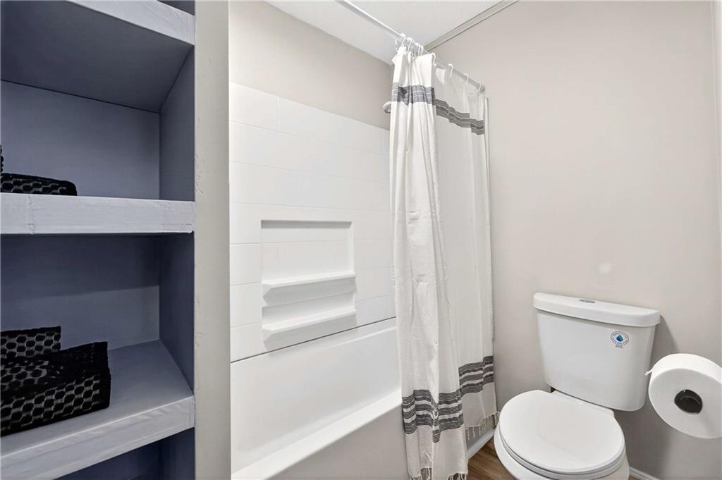 752 Maple Drive Riverdale, GA 30274 - Photo 24 of 35 a white toilet sitting next to a bathroom sink