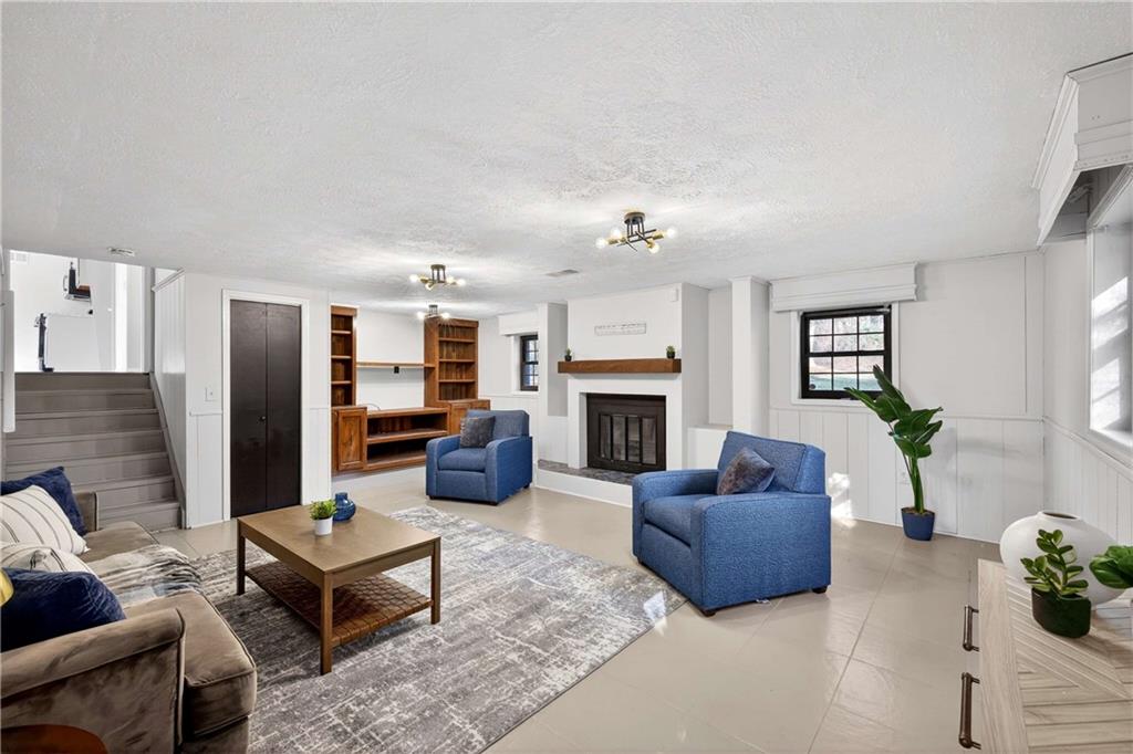 752 Maple Drive Riverdale, GA 30274 - Photo 25 of 35 a living room with furniture and a fireplace