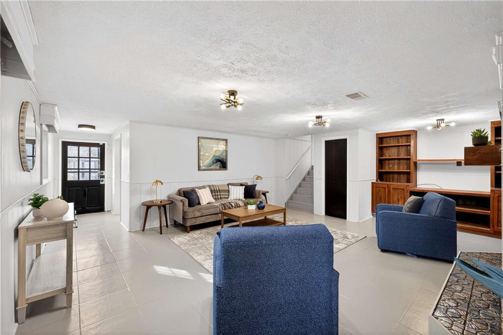 752 Maple Drive Riverdale, GA 30274 - Photo 26 of 35 a living room with furniture kitchen view and a couch