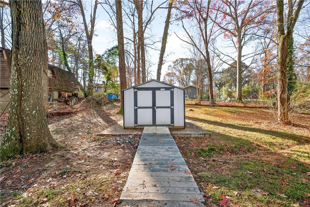 752 Maple Drive Riverdale, GA 30274 - Photo 29 of 35 a view of a pathway with a yard