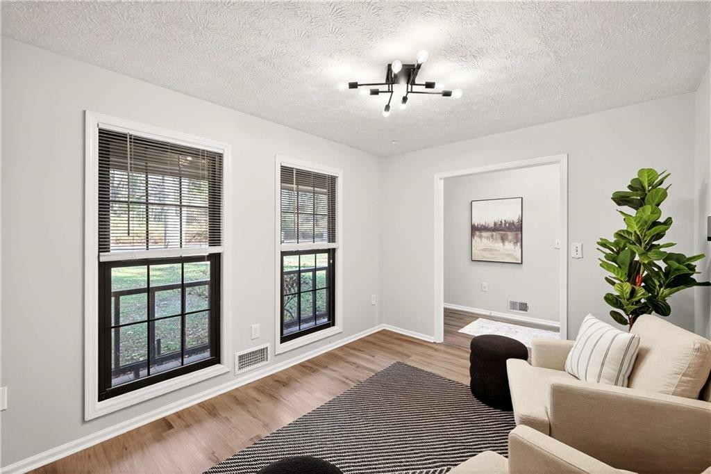 752 Maple Drive Riverdale, GA 30274 - Photo 5 of 35 a living room with furniture and a large window