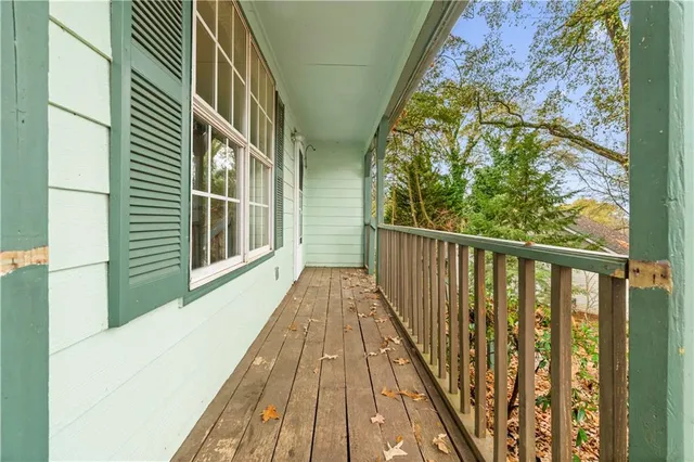 a view of balcony with wooden floor