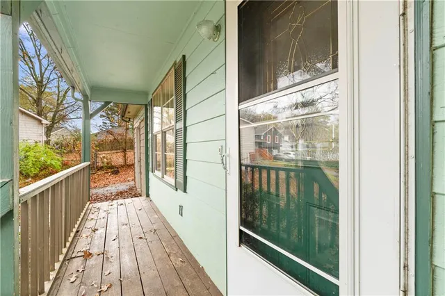 a view of a balcony with wooden floor