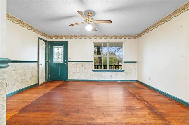 a view of an empty room with a window