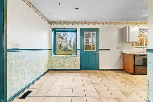 a view of a kitchen with a window