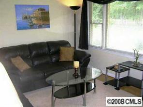 2187 Airdale Road Lancaster, SC 29720 - Photo 7 of 8 a living room with furniture and a floor to ceiling window