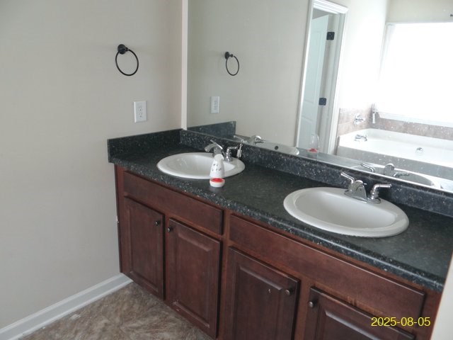 2 Sugar Maple Drive Fort Mitchell, AL 36856 - Photo 19 of 21 a bathroom with a granite countertop sink and a mirror