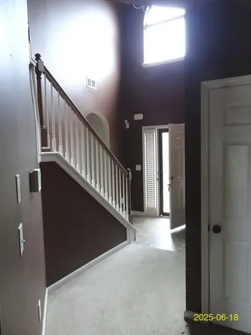 a view of a hallway with windows