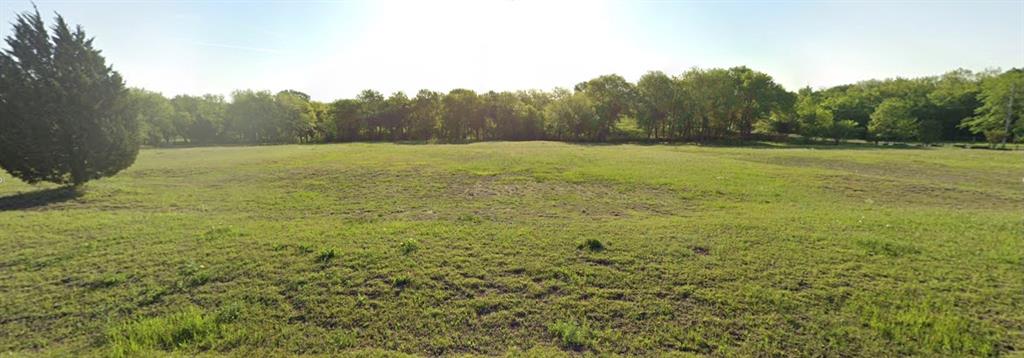 -tbd Golf Walk Circle Denison, TX 75020 - Photo 3 of 3 a view of a field with trees in the background