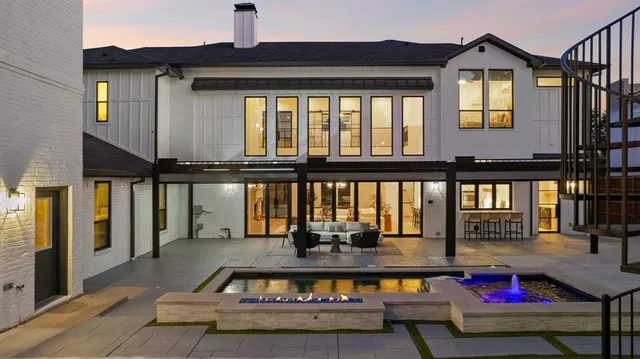 a view of swimming pool with seating area