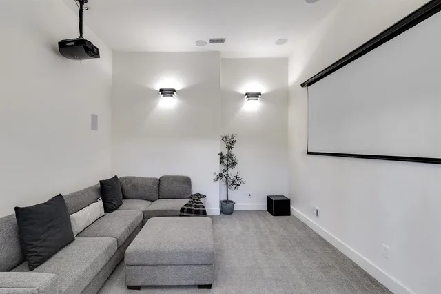 a living room with furniture and a lamp