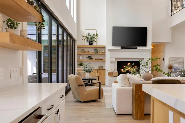 a living room with fireplace furniture and a flat screen tv