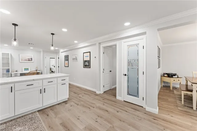 a large bathroom with a glass door shower and sink