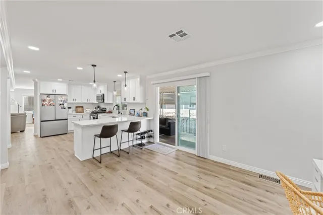 a view of a kitchen and dining room
