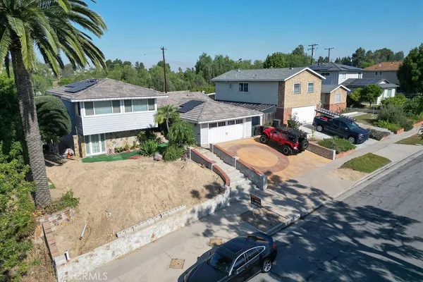 a view of multiple houses with yard