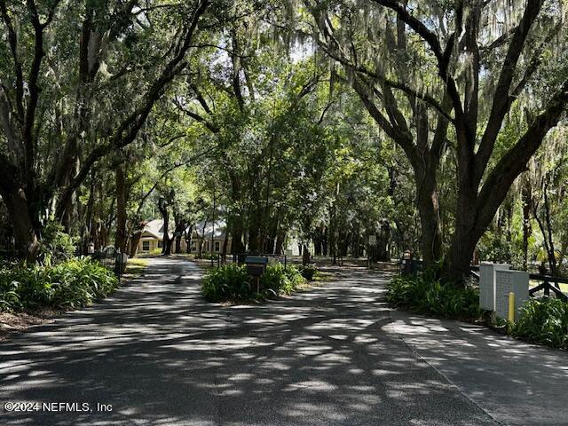 09 Southeast 265th Court Road Umatilla, FL 32784 - Photo 13 of 38 a view of street with trees